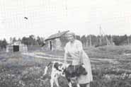 Mrs. Brankley with a cow on her farm.  Photo courtesy of "Voices from the Past: Garson Remembers".
