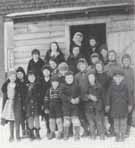 Children standing in front of S.S. #2 School on O'Neil farm.  Photo courtesy of "Voices from the Past: Garson Remembers".