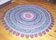 Multi-coloured, braided rug