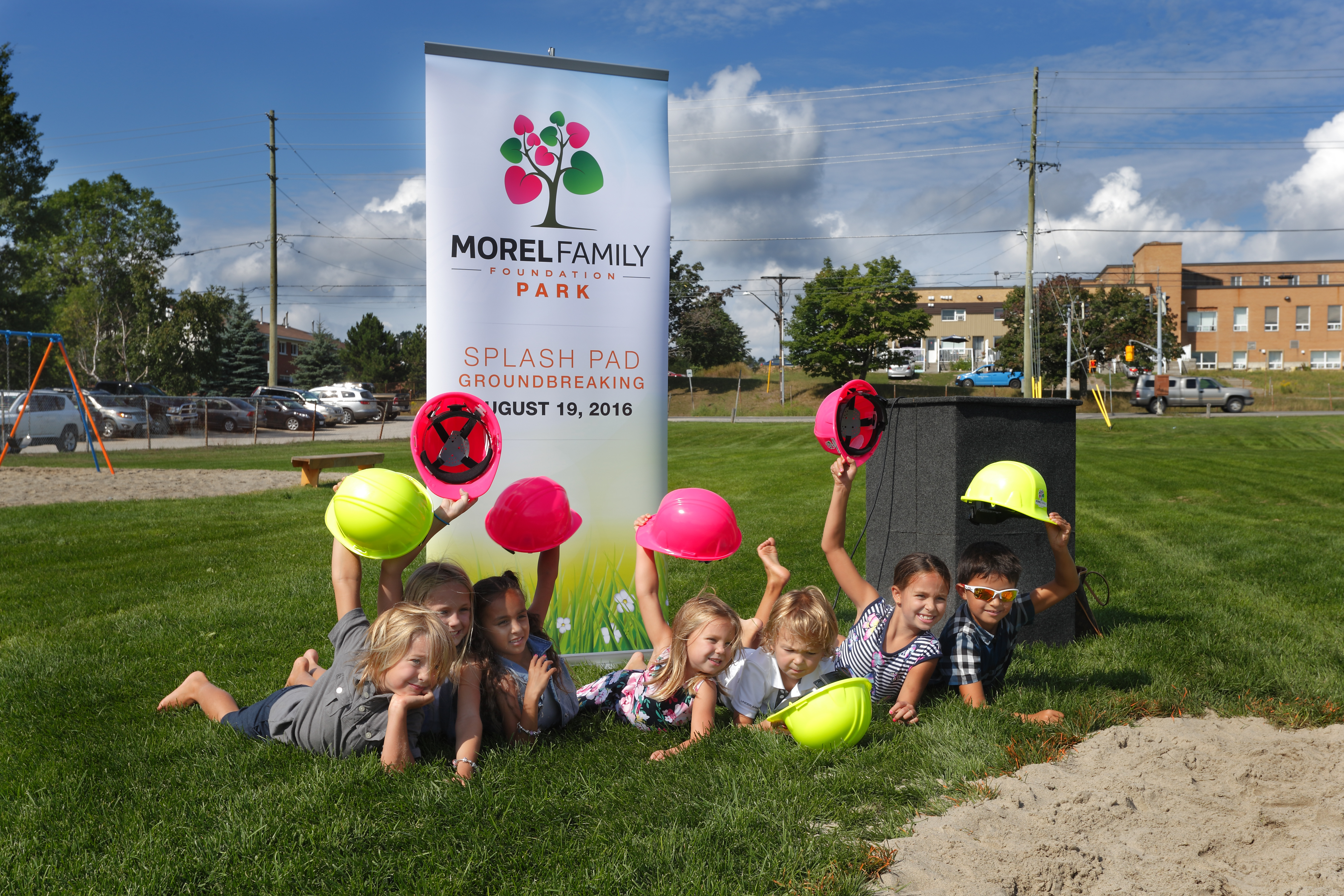 group of kids on the grass at Morel Family Foundation Park groundbreaking