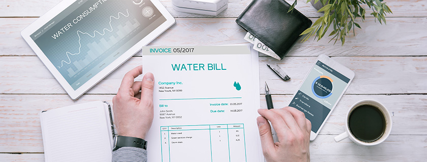 A person looking over their water bill