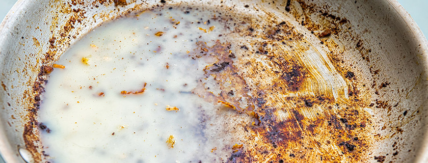 A dirty pan with congealed bacon grease.